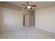 Spacious bedroom featuring neutral carpeting and a ceiling fan, bathed in natural light at 1292 Large Cap Dr # 3, Henderson, NV 89074