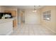 Bright dining area with tile floor adjacent to the kitchen, with view to hall at 1292 Large Cap Dr # 3, Henderson, NV 89074