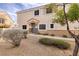 Exterior view of a home featuring a stone-accented entrance and desert landscaping at 1292 Large Cap Dr # 3, Henderson, NV 89074