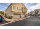 Exterior of a two-story home featuring attached garages and a front balcony in a community setting at 1292 Large Cap Dr # 3, Henderson, NV 89074