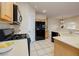 Modern kitchen features stainless appliances, white countertops, and a tile floor at 1292 Large Cap Dr # 3, Henderson, NV 89074