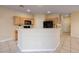 The bright kitchen features an island, wood cabinets, and stainless steel appliances at 1292 Large Cap Dr # 3, Henderson, NV 89074