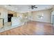 Open-concept living room with wood floors, neutral paint, and a ceiling fan at 1292 Large Cap Dr # 3, Henderson, NV 89074