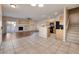 Open-concept living and kitchen area with a fireplace and tile flooring at 1292 Large Cap Dr # 3, Henderson, NV 89074