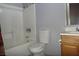 This bathroom features a tub/shower combination and a wood vanity at 1437 Blankenship Ave, Las Vegas, NV 89106