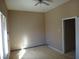 Bedroom featuring light wood floors, light colored walls and slider window at 1437 Blankenship Ave, Las Vegas, NV 89106