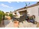 Outdoor patio featuring a dining table and chairs surrounded by landscaping, under a blue sky at 1451 Di Blasi Dr # 102, Las Vegas, NV 89119