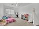 Bedroom featuring carpet floors and a sunny window at 1914 Night Shadow Ave, North Las Vegas, NV 89031