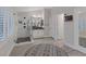 A bright main bathroom with a glass enclosed shower, modern fixtures, and natural light with stylish gray flooring at 1921 Spyglass Dr, Henderson, NV 89074