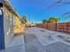 Wide view of the home's backyard, with a fence and gravel at 2324 E Oakey Blvd, Las Vegas, NV 89104