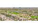 Expansive aerial view of a luxurious neighborhood, highlighting the lush golf course and elegant homes at 2690 Grassy Spring Pl, Las Vegas, NV 89135