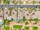 Aerial view of luxury homes with pools, landscaping, and golf course frontage in a desert community at 2690 Grassy Spring Pl, Las Vegas, NV 89135