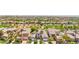 Wide aerial view of luxury homes with golf course views in a desert community at 2690 Grassy Spring Pl, Las Vegas, NV 89135