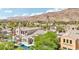 Overhead shot of a luxurious community nestled near a golf course and mountains at 2690 Grassy Spring Pl, Las Vegas, NV 89135
