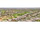 Overhead perspective of a refined residential area featuring manicured green spaces and upscale homes at 2690 Grassy Spring Pl, Las Vegas, NV 89135