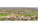 Wide aerial shot of a prestigious community with a golf course, palm trees, and beautifully landscaped residences at 2690 Grassy Spring Pl, Las Vegas, NV 89135