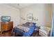 Bedroom featuring hardwood floors, queen bed, and neutral decor at 2690 Grassy Spring Pl, Las Vegas, NV 89135