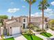 Charming two-story home with desert landscaping, a two-car garage, and a welcoming entrance at 2690 Grassy Spring Pl, Las Vegas, NV 89135