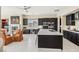 Well-lit kitchen with an island and stainless steel appliances, perfect for cooking and entertaining at 2690 Grassy Spring Pl, Las Vegas, NV 89135