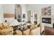 Bright living room boasts dark wood floors, high ceilings, fireplace, and plentiful seating at 2690 Grassy Spring Pl, Las Vegas, NV 89135