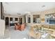 Open-concept space offers a spacious living area with tiled floors and abundant natural light at 2690 Grassy Spring Pl, Las Vegas, NV 89135
