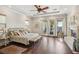 Relaxing main bedroom with hardwood floors, a fireplace, and a door to the backyard and pool at 2690 Grassy Spring Pl, Las Vegas, NV 89135