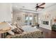 Spacious main bedroom with wooden floors, a fireplace, and access to an outdoor seating area at 2690 Grassy Spring Pl, Las Vegas, NV 89135