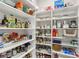 Organized pantry with shelves stocked full of food and kitchen supplies in a clean, accessible space at 2690 Grassy Spring Pl, Las Vegas, NV 89135