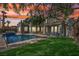 Backyard featuring a refreshing swimming pool, a spa, and ample seating space for outdoor entertainment at 2690 Grassy Spring Pl, Las Vegas, NV 89135