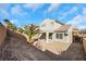 View of the backyard with rock landscaping and covered patio area at 2849 Blythswood Sq, Henderson, NV 89044