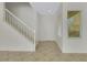 Bright foyer with tile flooring, a staircase, and a window with blinds at 2849 Blythswood Sq, Henderson, NV 89044