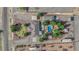 Breathtaking aerial view of a desert property with an inviting pool, lush landscaping, and ample parking at 2901 S Dandelion St, Pahrump, NV 89048