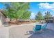 Expansive backyard with a deck, built-in barbecue, patio, and ample seating areas at 2901 S Dandelion St, Pahrump, NV 89048