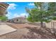 Fenced backyard featuring a bark-covered play area at 2901 S Dandelion St, Pahrump, NV 89048