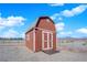 Exterior view of the barn-style shed showcasing its classic design and ample storage at 2901 S Dandelion St, Pahrump, NV 89048