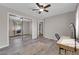 Bedroom featuring wood-look flooring, neutral walls, and a mirrored closet at 2901 S Dandelion St, Pahrump, NV 89048