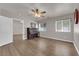 Bedroom view showcasing hardwood floors, ceiling fan, and neutral paint tones at 2901 S Dandelion St, Pahrump, NV 89048