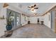 Versatile bonus room with tile floors, shelving, and French doors leading to the outdoors at 2901 S Dandelion St, Pahrump, NV 89048