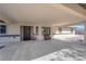 Covered carport with a decorative door and ample parking space at 2901 S Dandelion St, Pahrump, NV 89048