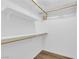 Walk-in closet features built-in shelves, wooden rails, and hardwood flooring at 2901 S Dandelion St, Pahrump, NV 89048