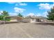 Property exterior featuring a covered parking area with easy access to the home, complemented by desert landscaping at 2901 S Dandelion St, Pahrump, NV 89048