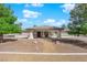 Charming single-story home featuring stucco and stone facade, desert landscaping, and a welcoming walkway at 2901 S Dandelion St, Pahrump, NV 89048