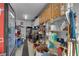 Garage interior displaying shelves, tool chests, and a soda cooler, maximizing storage and organization options at 2901 S Dandelion St, Pahrump, NV 89048
