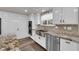 Charming kitchen features white cabinets, stainless steel appliances, and beautiful countertops at 2901 S Dandelion St, Pahrump, NV 89048