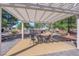Patio seating under a trellis with backyard pool in view at 2901 S Dandelion St, Pahrump, NV 89048