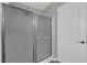 Bathroom featuring glass-enclosed shower, and a white door at 2901 S Dandelion St, Pahrump, NV 89048