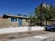 Modest single-story home featuring a light-colored exterior and a small front yard with desert landscaping at 333 N 13Th St, Las Vegas, NV 89101