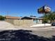 Shot of a single-story home featuring a light-colored exterior and a fenced backyard at 333 N 13Th St, Las Vegas, NV 89101