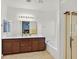Bright bathroom featuring double sinks, a bathtub, and a glass door shower at 376 Shanon Springs St, Henderson, NV 89014