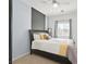 Bedroom featuring a full-sized bed, and window with blinds and curtains at 376 Shanon Springs St, Henderson, NV 89014